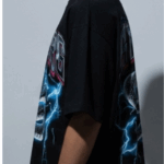 Unleash your inner power with the Men’s Black “CYBORG” Oversized Snake Graphic T-Shirt, designed for bold streetwear enthusiasts. Featuring a striking cyber-serpent coiled in lightning and futuristic “CYBORG” typography, this tee makes an electrifying statement. Crafted from premium cotton in an oversized fit, it's perfect for those who live life on the edge of fashion and technology. Key Features: High-impact cyber snake graphic with electric blue lightning effect “CYBORG” metallic-style text for a futuristic street vibe Relaxed, oversized fit for comfort and trend-forward style Durable cotton fabric that feels soft and breathable Ideal for concerts, nightlife, urban streetwear, and casual daily wear