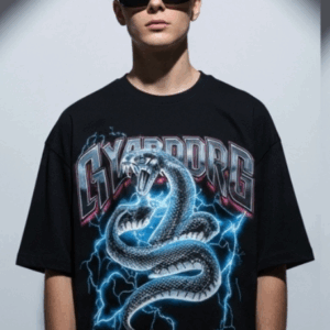 Unleash your inner power with the Men’s Black “CYBORG” Oversized Snake Graphic T-Shirt, designed for bold streetwear enthusiasts. Featuring a striking cyber-serpent coiled in lightning and futuristic “CYBORG” typography, this tee makes an electrifying statement. Crafted from premium cotton in an oversized fit, it's perfect for those who live life on the edge of fashion and technology. Key Features: High-impact cyber snake graphic with electric blue lightning effect “CYBORG” metallic-style text for a futuristic street vibe Relaxed, oversized fit for comfort and trend-forward style Durable cotton fabric that feels soft and breathable Ideal for concerts, nightlife, urban streetwear, and casual daily wear